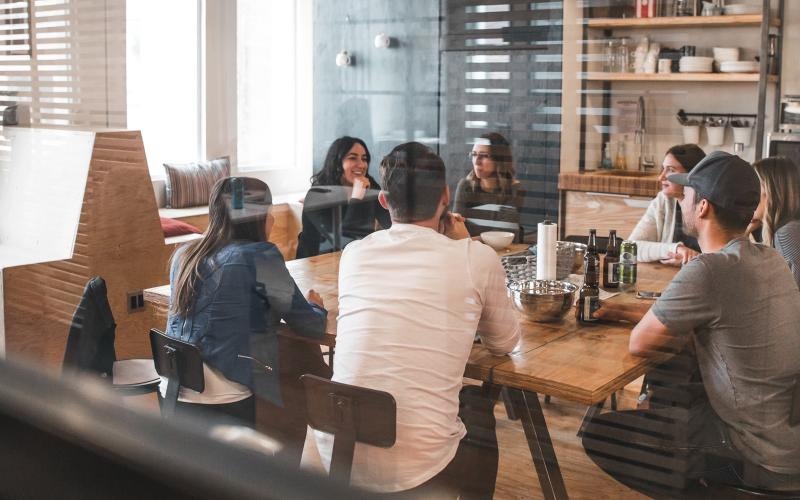 a group of people sitting at a table